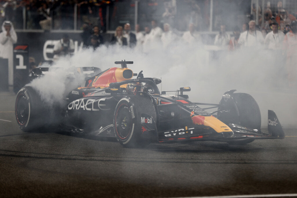 F1 car spinning tires on the track